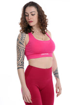 Top sportivo INES intrecciato fucsia